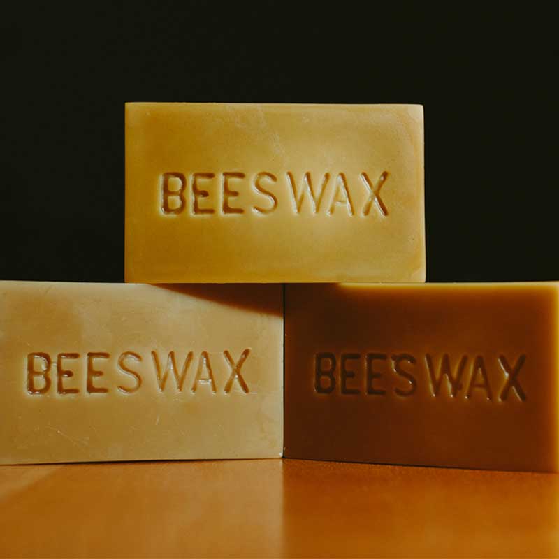 Blocks of beeswax inscribed with the word "Beeswax"